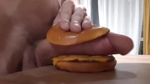 Muscular horny teen fucks a burger with a big learn of and cums in it