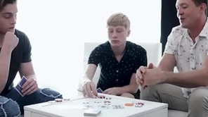Backstage heated poker match: whoever loses has to give around their hole to the other two!